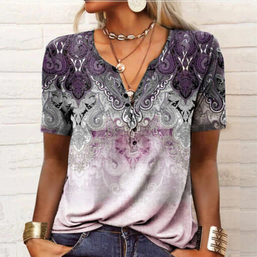 Woman wearing paisley patterned v-neck blouse.