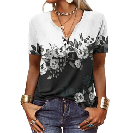 Woman wearing floral V-neck T-shirt and jeans.