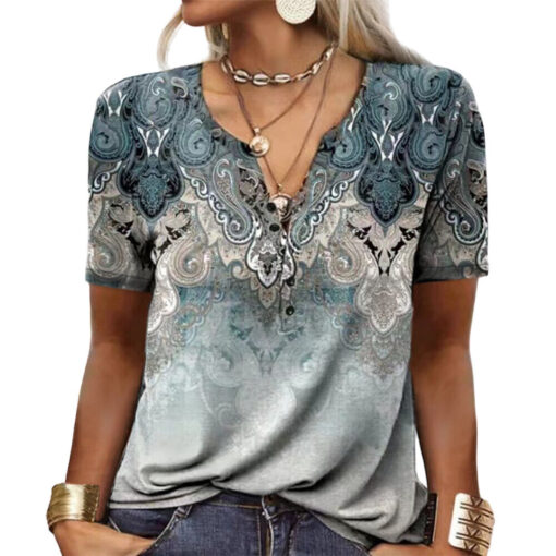 Woman wearing paisley patterned t-shirt with accessories.