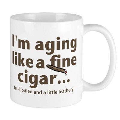 Humorous aging-themed mug with cigar illustration.