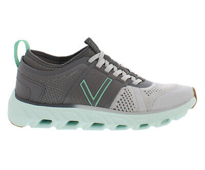 Grey running shoe with green accent and unique sole.