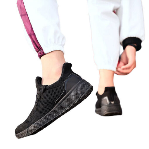 Black sneakers and white jogger pants on person.