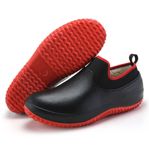 Black slip-on shoes with red soles.