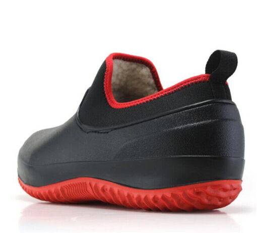 Black and red rubber shoe on white background.