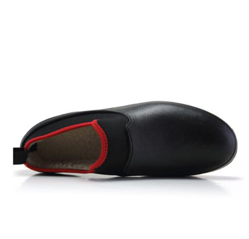 Black slip-on shoe with red trim.