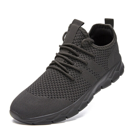 Black knit running shoe on white background.