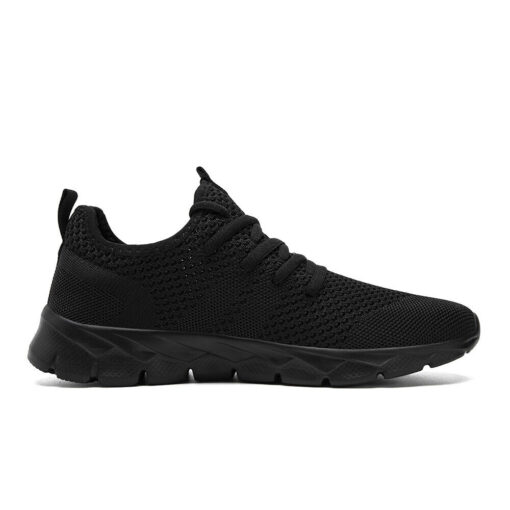 Black athletic running shoe on white background.