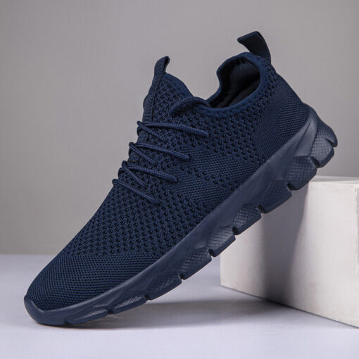 Navy blue running shoe on white block