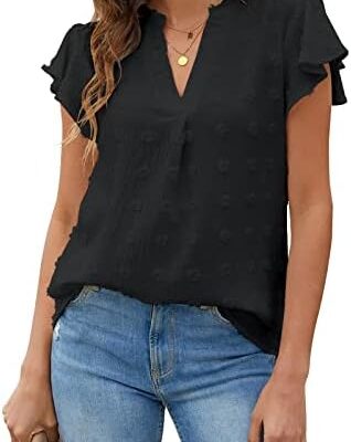 Woman wearing black ruffle sleeve blouse and jeans.