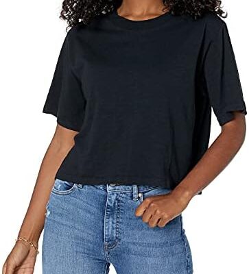 Woman in black t-shirt and blue jeans.