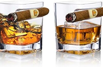 Whiskey glasses with cigars on top.