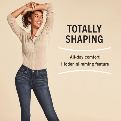 Woman posing in slimming jeans with comfort features.