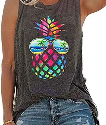 Woman wearing colorful pineapple graphic tank top.