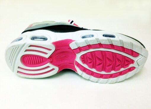 Pink and white athletic shoe sole.