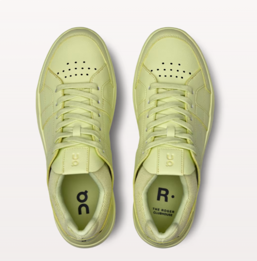 Pair of pale green sneakers, top view.