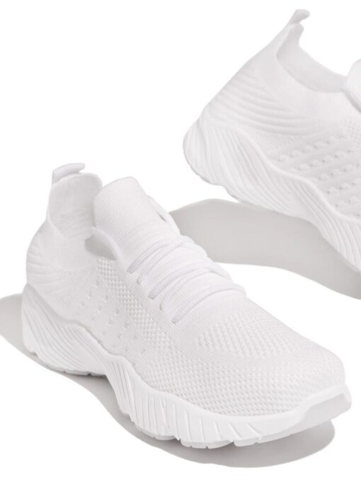 White athletic sneakers on white background.