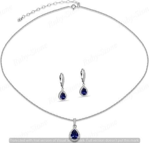 Silver necklace and earrings set with blue stones.