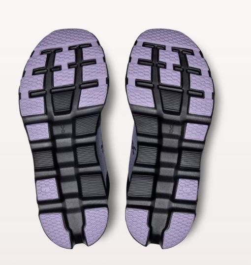 Purple and black running shoe soles.