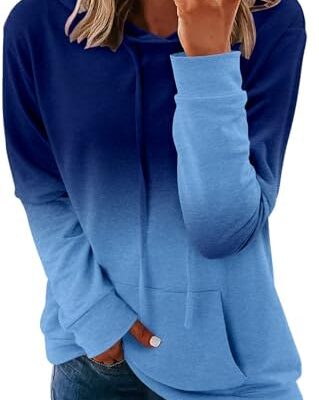 Woman wearing blue gradient hoodie and jeans.