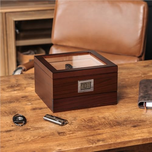 Wooden watch box on table with glass lid