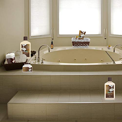 Luxurious bathtub with spa essentials displayed around.