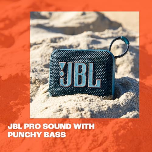 JBL speaker on sandy beach